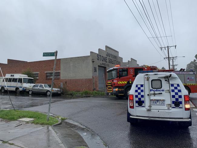 Road blocked as firefighters tackle factory fire