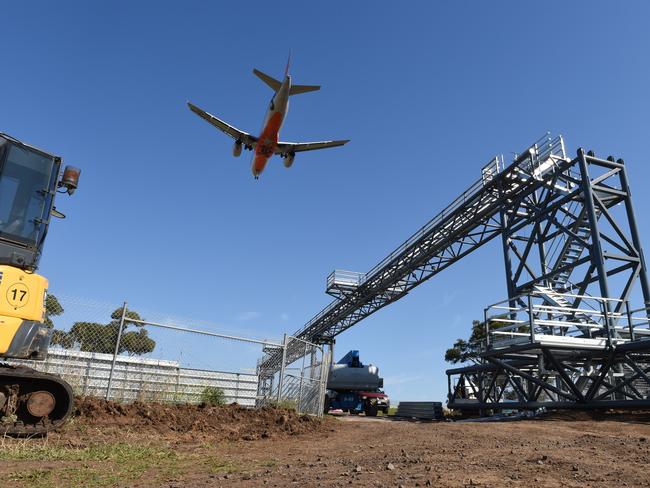 A plane flies over Melbourne Airport. Picture: Kylie Else