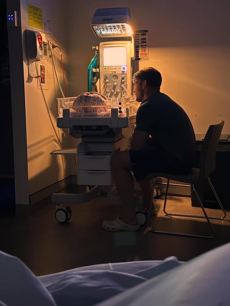 Jai Arrow watches over his new daughter.