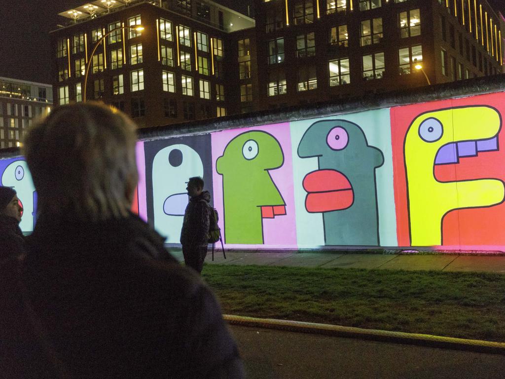 More than 200 events will take place around the city for the celebrations this week. Pictured, a projection on the East Side Gallery, one of the largest remaining sections of the wall in Berlin. Picture: Carsten Koall/Getty Images.
