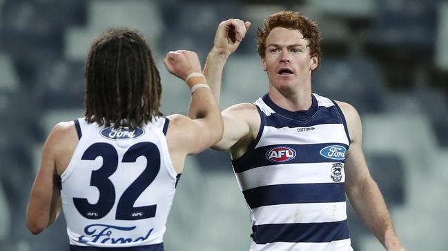 Gary Rohan and Gryan Miers celebrate a goal during Geelong’s fruitless comeback.