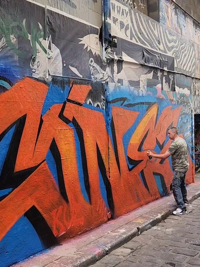 The artist was filmed spraying his own piece. Picture: Facebook.