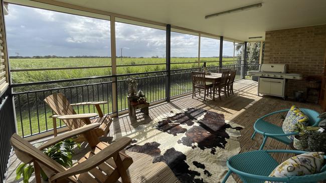 The property includes a four-bedroom, two-storey home set against a stunning rural backdrop. Picture: Ray White Sarina Rural