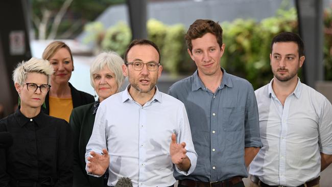 Greens leader Adam Bandt (C) holds with their candidates including L-R Penny Allman-Payne (Senate), Elizabeth Watson-Brown (seat of Ryan) Max Chandler-Mather (seat of Griffith), Stephen Bates (seat of Brisbane). Picture: Lyndon Mechielsen/The Australian