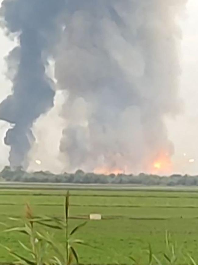 Fire and smoke billows from a munitions depot in Crimea. Picture: AFP