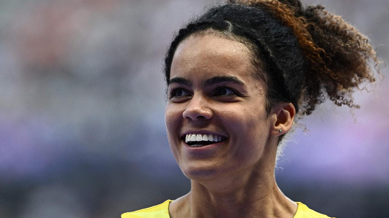 All smiles... Australia's Torrie Lewis after making the 200m semi finals. Picture: AFP