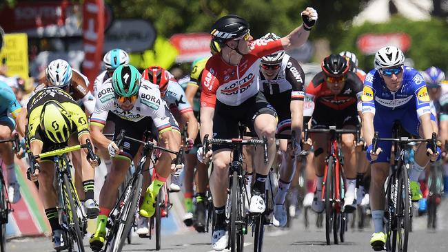 ADELAIDE, AUSTRALIA - JANUARY 16: (L-R) Caleb Ewan of Australia and Mitchelton-Scott, Peter Sagan of Slovakia and Bora-Hansgrohe and Andre Greipel of Germany and Lotto Soudal compete across the finish line during stage one of the 2018 Tour Down Under on January 16, 2018 in Adelaide, Australia.  (Photo by Daniel Kalisz/Getty Images)