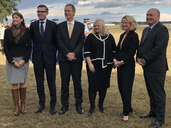 East Hills MP Wendy Lindsay, Treasurer Dominic Perrottet, Peter Achterstraat, chairman of Sydney Metro Airports, Lee de Winton, CEO, Sydney Metro Airports, Deanne Stewart, CEO, First State Super, and Police Minister David Elliott at Bankstown Airport. Picture: Lawrence Machado