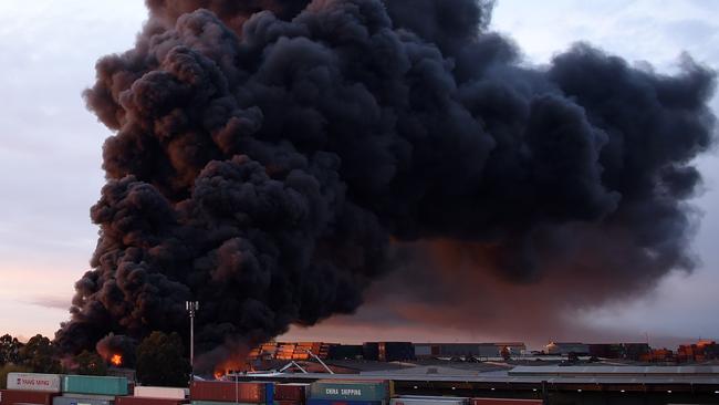 Acrid smoke billows from a factory fire in West Footscray last August. Picture: Nicole Garmston