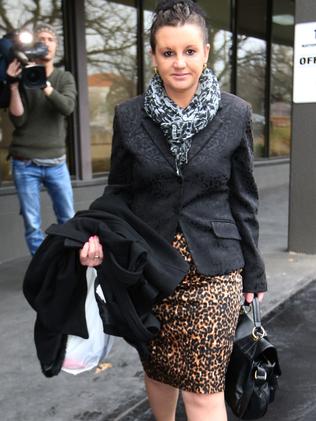 Palmer United Party Senator Jacqui Lambie leaves the National Press Club in Canberra.