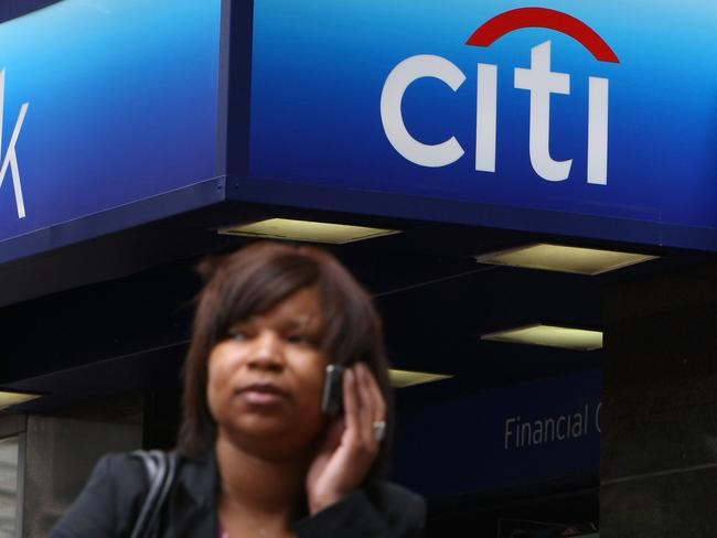 A pedestrian walks by a Citibank office on 18 Jul 2008 in San Francisco, California. Citigroup, the nation's largest banking company, reported a second quarter loss of $2.5 billion or 54 cents per share as the company struggles with continuing bank loan defaults. Citi earned $6.23 billion or $1.24 per share one year ago.