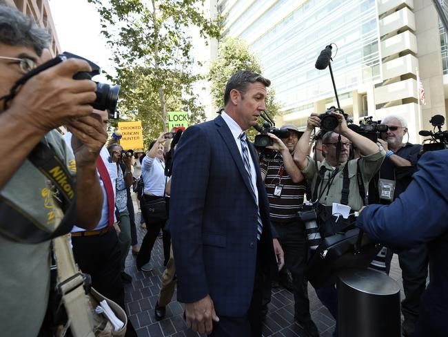 U.S. Rep. Duncan Hunter, center, leaves an arraignment hearing Thursday, Aug. 23, 2018, in San Diego. Hunter and his wife Margaret pleaded not guilty Thursday to charges they illegally used his campaign account for personal expenses. (AP Photo/Denis Poroy)