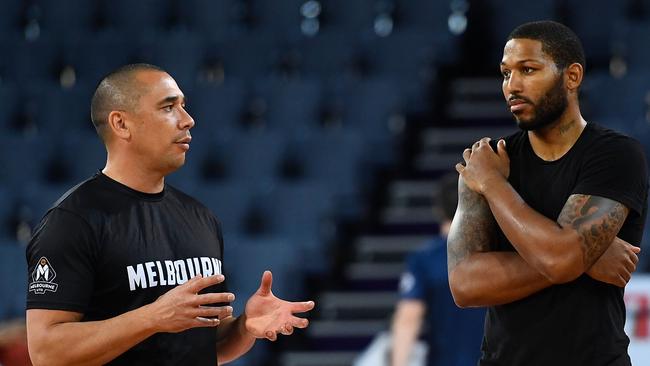 CAIRNS, AUSTRALIA — NOVEMBER 03: DJ Newbill of the Taipans talks with Melbourne United assistant coach Paul Henare before the start of the round four NBL match between the Cairns Taipans and Melbourne United at Cairns Convention Centre on November 3, 2018 in Cairns, Australia. (Photo by Ian Hitchcock/Getty Images)