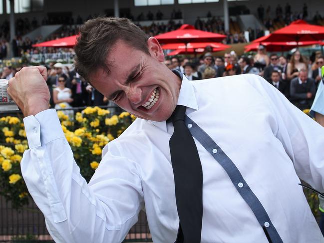 DERBY DAY 2012. FLEMINGTON RACECOURSE. A punter is overcome after backing the winning horse in race 8.