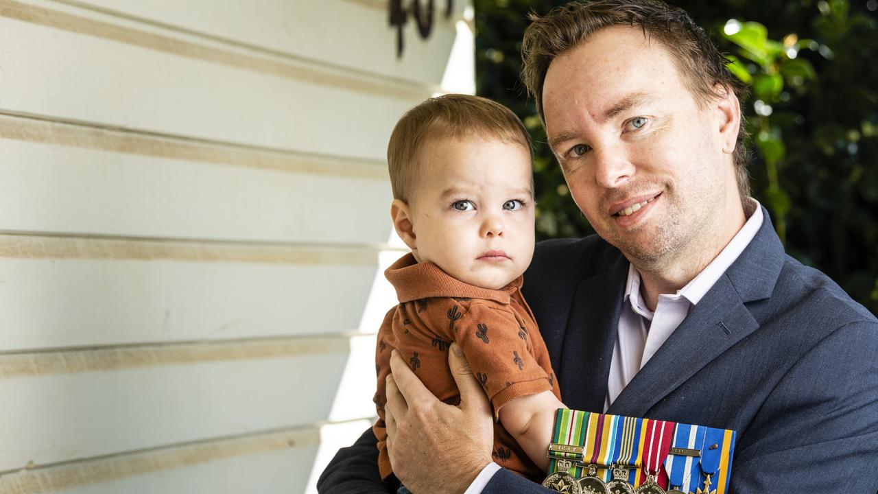 Ben Quirke holding his son Riley Quirke for Anzac Day profile, Tuesday, April 19, 2022. Picture: Kevin Farmer