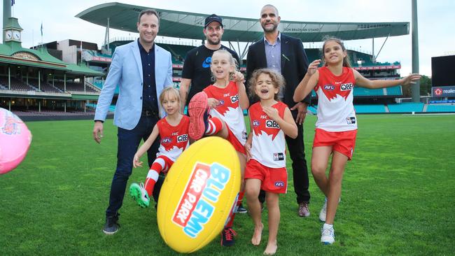 Former Sydney players Jude Bolton, with daughter Siarra, Nick Davis and daughter Jordan and Michael O'Loughlin with daughters Taya and Leni at the SCG. Picture: Mark Evans