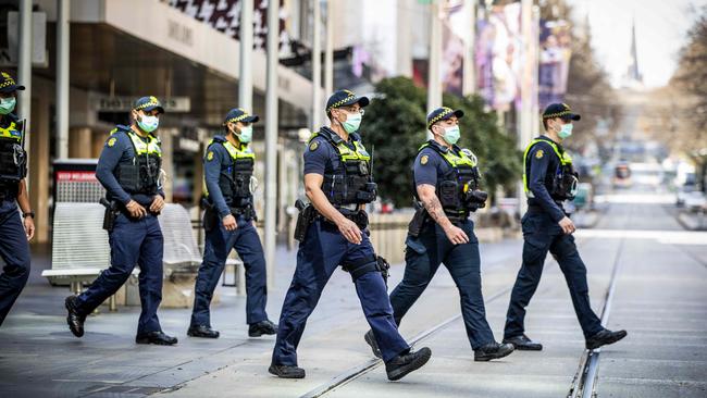 A patrol in the Bourke Street Mall, which has been left near empty amid the pandemic. Picture: Nicole Cleary