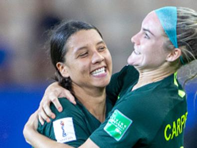 GRENOBLE, FRANCE June 18. Sam Kerr #20 of Australia, after scoring four goals, celebrates with teammate Ellie Carpenter #21 of Australia at the end of the game during the Jamaica V Australia, Group C match at the FIFA Women's World Cup at Stade des Alpes on June 18th 2019 in Grenoble, France. (Photo by Tim Clayton/Corbis via Getty Images)