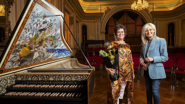 Artist Deborah Wace and Arts Minister Elise Archer beside the new harpsichord purchased by donated funds for Van Diemen's Band. (Supplied: Richard Jupe)