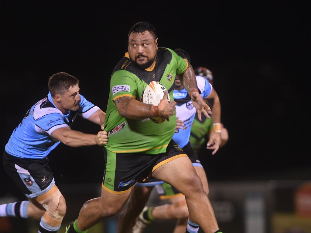 Palmerston Raiders Joel Turaga breaks through the Northern Sharks line in the NRLNT Grand Final 2022. Picture: (A)manda Parkinson