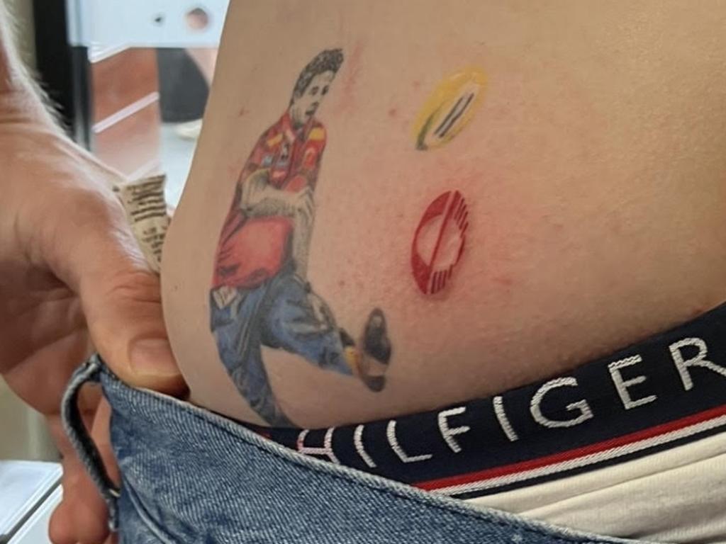 Daniel Gorringe's latest tattoo of the Gold Coast Suns new logo. November 15, 2025.