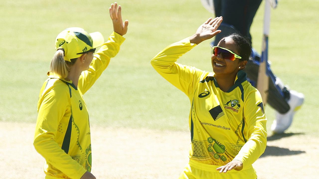 MELBOURNE, AUSTRALIA - FEBRUARY 08: Alana King (R) of Australia celebrates with teammate Meg Lanning after dismissing Tammy Beaumont of England during game three of the Women's Ashes One Day International series between Australia and England at Junction Oval on February 08, 2022 in Melbourne, Australia. (Photo by Mike Owen/Getty Images)