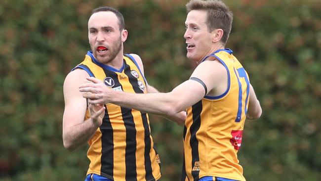 Michael Caven (left) celebrates with Chad Jones after kicking a goal. Picture: David Crosling