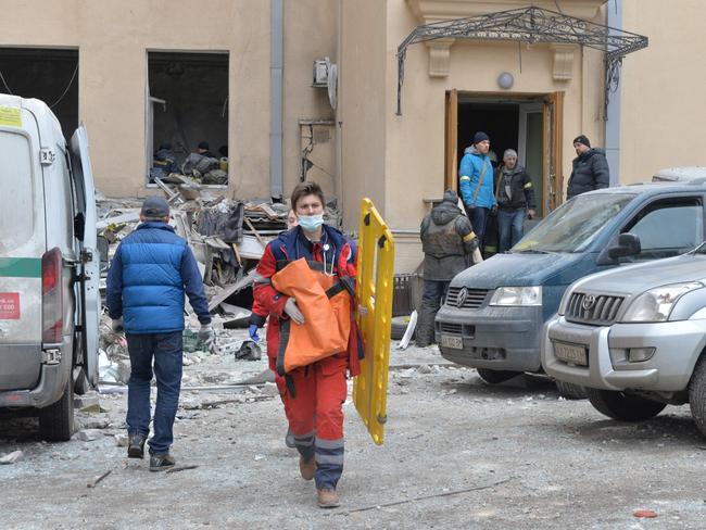 Medics walk outside the damaged local city hall of Kharkiv. Picture: AFP