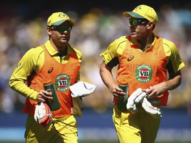 Faulkner (R) and Clarke ran the drinks for Australia at the MCG last weekend.