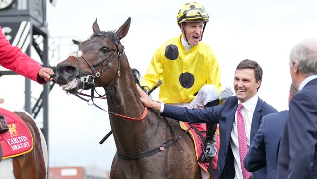 Mark Zahra celebrates winning his second Caulfield Cup aboard Without A Fight on Saturday. Photo: Scott Barbour/Getty Images.