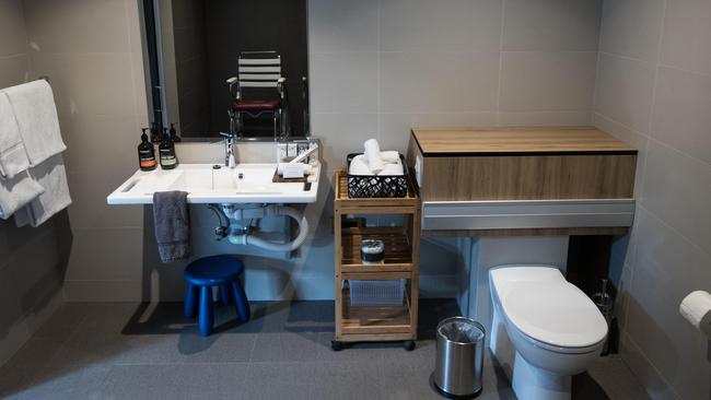 The bathroom features flush sensors and a sink which can be raised or lowered. Picture: Julian Andrews