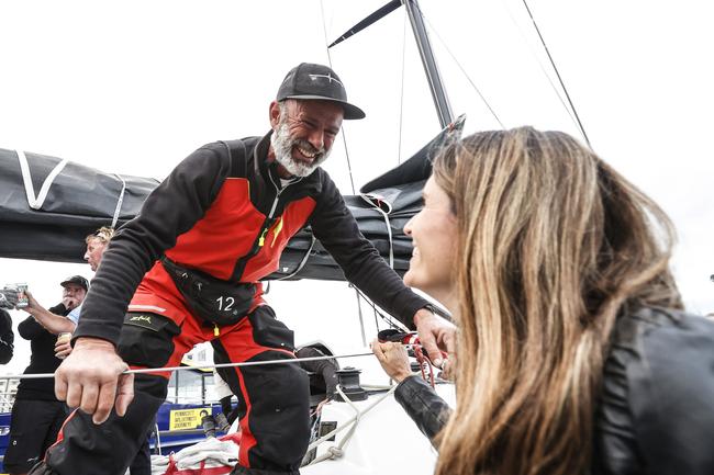 Alive skipper Duncan Hine kisses wife Kate as Alive claimed line honours in the 2020 Launceston to Hobart yacht race. Picture: Zak Simmonds