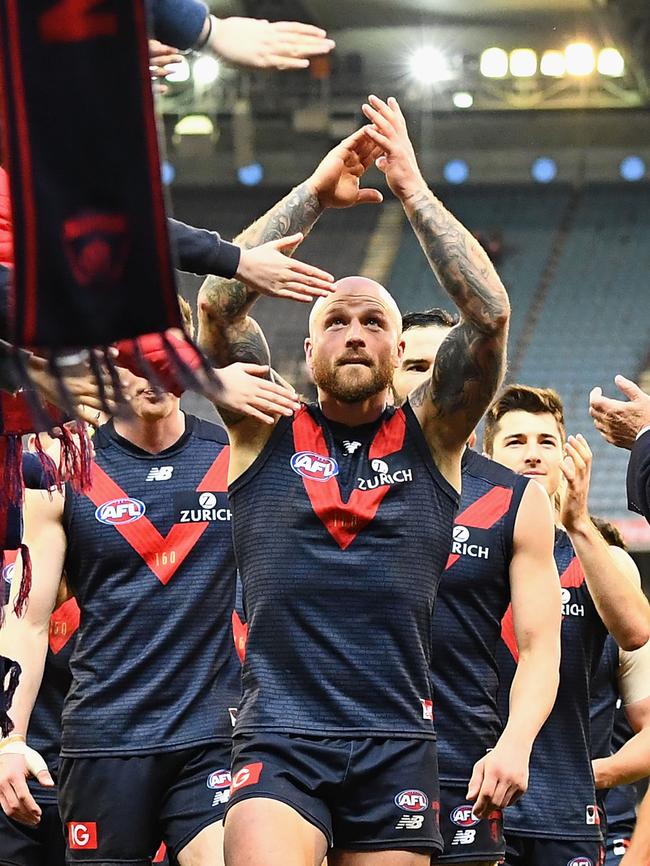 Melbourne captain Nathan Jones applauds fans while leading his charges off the ground. Picture: Getty Images