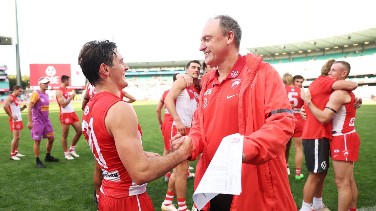 The Swans and Suns wore black armbands for the game. (Photo by Matt King/AFL Photos/via Getty Images )