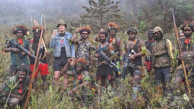 Philip Mehrtens pictured with fighters from the West Papuan National Liberation Army, the armed wing of the Free Papuan Movement, which is calling for independence from Indonesia.