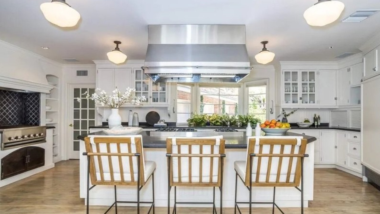 It has a luxury kitchen with an oversized, seated centre island. Picture: Realtor