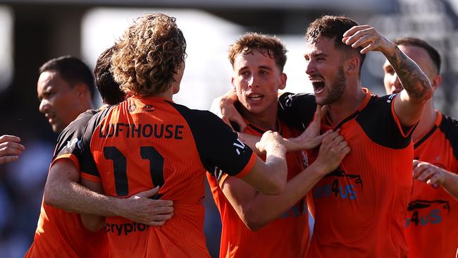 Jez Lofthouse (11) celebrates with his Roar teammates last season. Picture: Mark Kolbe/Getty Images