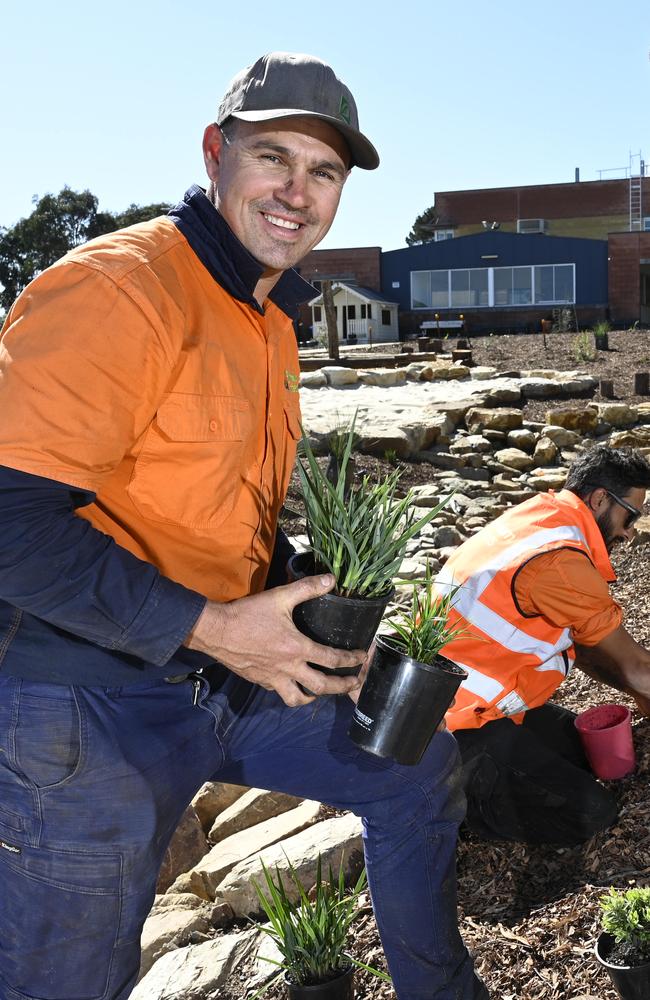 Landscaper Ben Wadley with workers Marco Nabulsi (centre) and Zac Hurley at work on the garden at the St Francis de Sales College. NCA NewsWire / David Mariuz