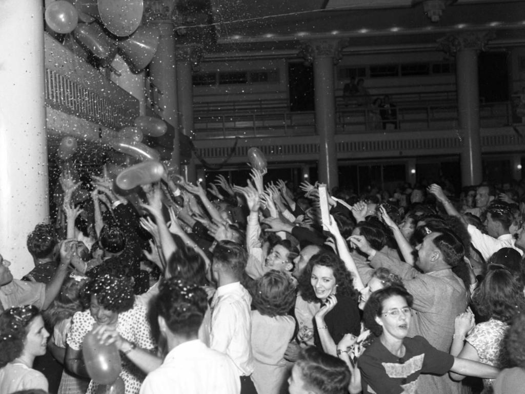 New Year revellers cheered and waved as balloons and confetti welcomed 1949 at the Cloudland Ballroom. Three thousand patrons were present. Photo: The Courier-Mail Photo Archive