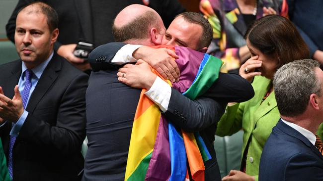 Liberal Member for North Sydney Trent Zimmerman and Liberal Member for Goldstein Tim Wilson celebrate the passing of the Marriage Amendment Bill in the House of Representatives at Parliament House in Canberra, Thursday, December 7, 2017. Picture: AAP /Mick Tsikas.