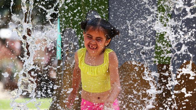 Five-year-old Ila-Anne Taylor on holidays from from Tamworth beating the heat at Broadwater Parklands. Photograph: Jason O'Brien