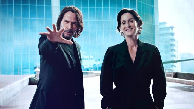 Keanu Reeves and Carrie-Anne Moss speak onscreen during The Game Awards 2021 in Los Angeles. Picture: Getty Images