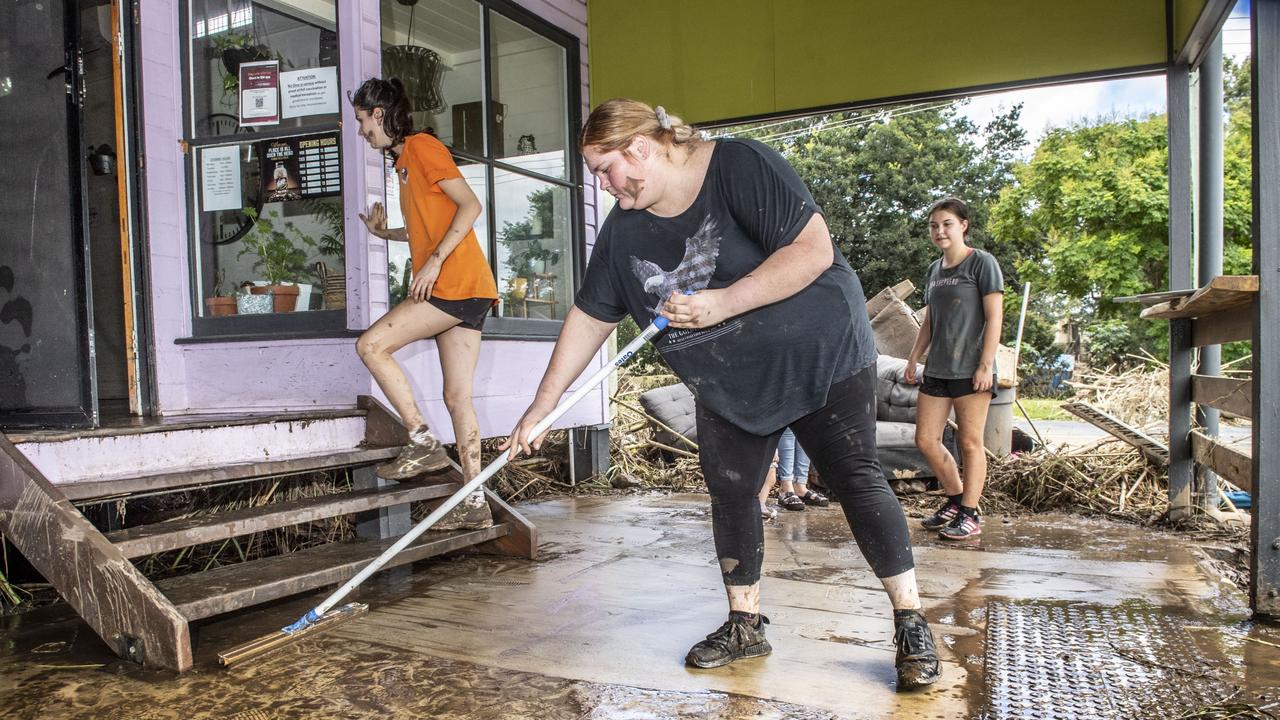 (from left) Grace Taylor, Riley Martin and Summer Smith clean up at The Floating Cafe in Grantham. Monday, February 28, 2022. Picture: Nev Madsen.