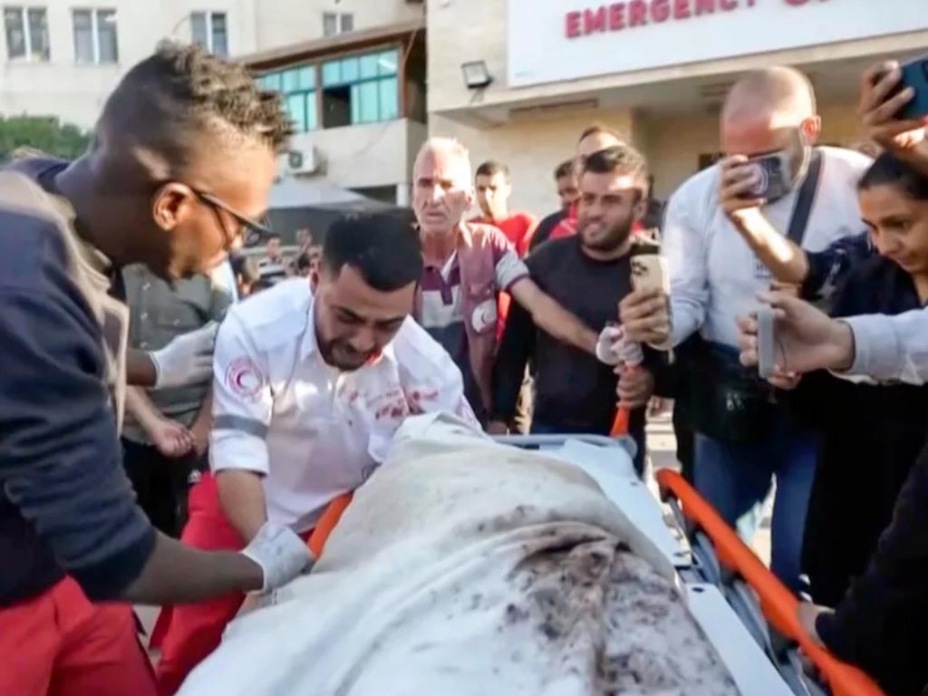 The moment medic Abed Bardini realised that he was transporting the body of his mother. Credit: Abed Al Kareem Hana/AP