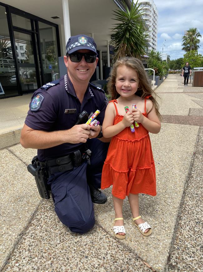 Senior Constable Jason Durant with four-year-old Harper Davie.