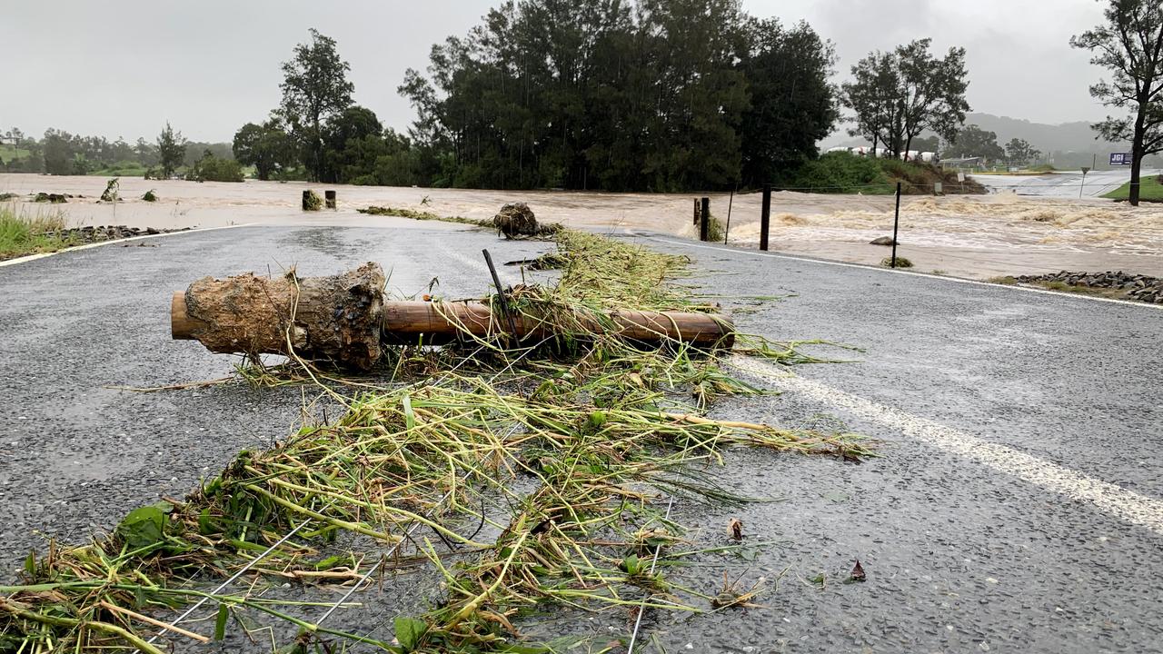 The causeway at Maudsland Drive, Oxenford, on the Gold Coast was blocked to all traffic due to high rising flood waters which damaged fences and the road surface. Picture: NCA NewsWire / Scott Powick