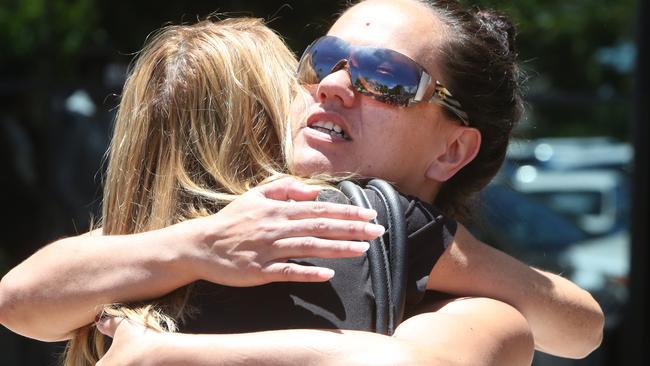 Family and friends lay roses outside court this morning in honor of Tara Brown. Picture: Richard Gosling