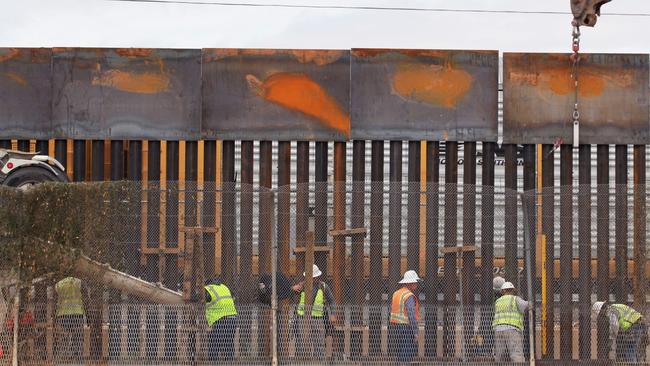 US workers construct a barrier on the border with Mexico’s Chihuahua state. Picture: AFP