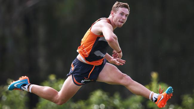 Devon Smith snaps a goal during GWS Giants training at Homebush.