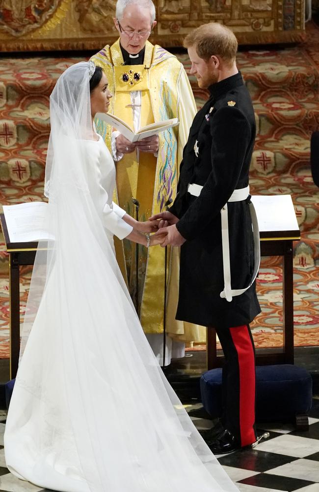 Prince Harry and Meghan Markle exchange vows at the ceremony. Picture: Owen Humphreys — WPA Pool/Getty Images.